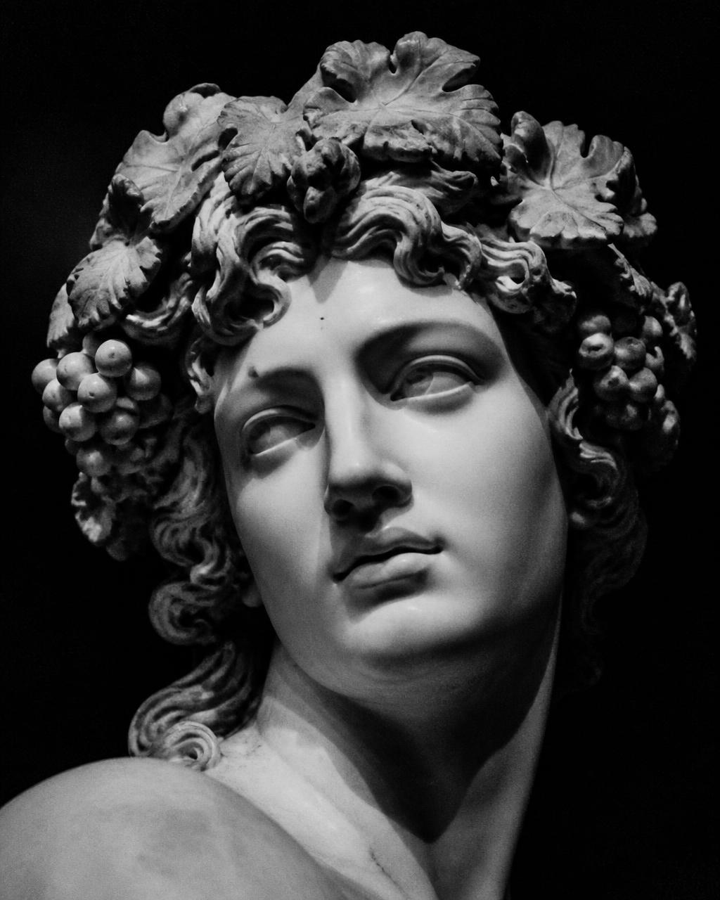 Monochrome marble bust of Dionysus crowned with vines